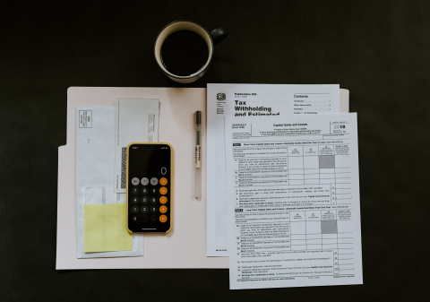 tax paperwork and a calculator