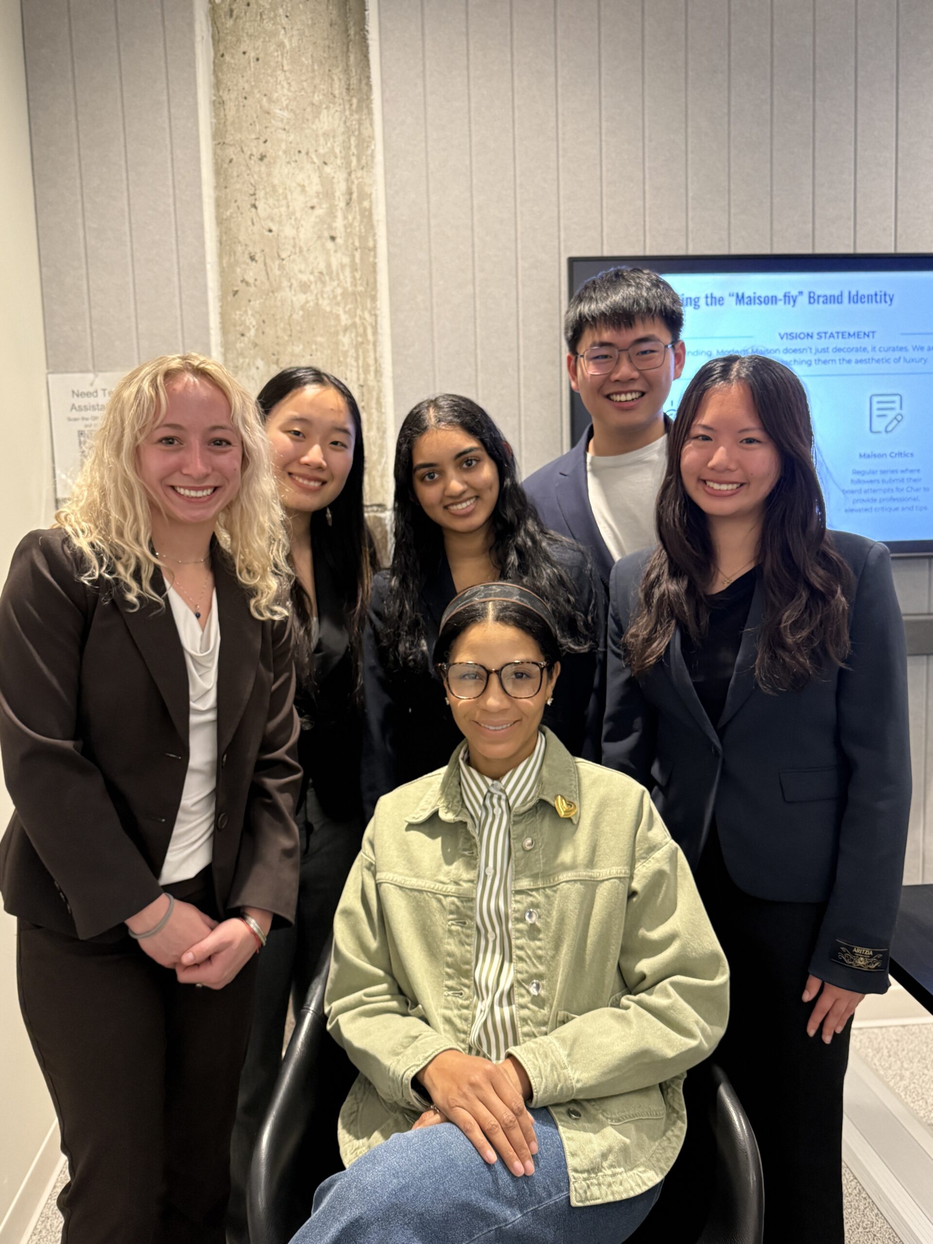 client sits in center, surrounded by her student team